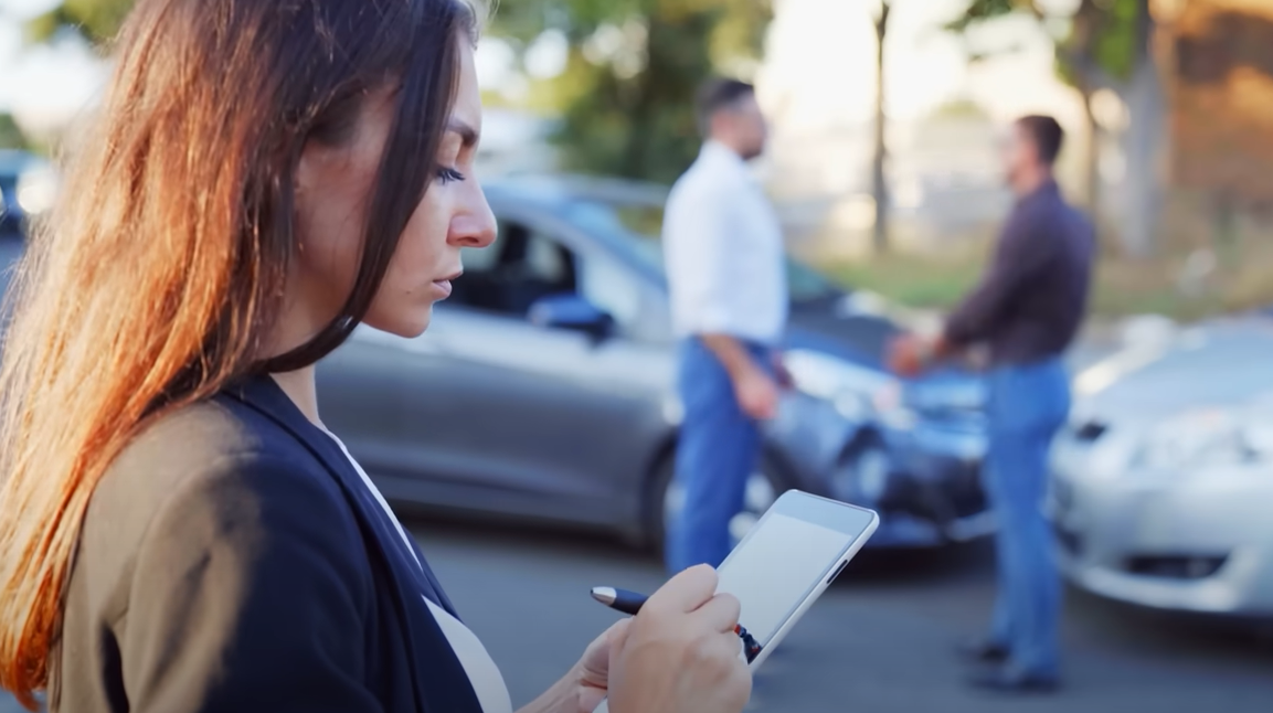a happy family standing in front of their car, symbolizing peace of mind and protection with comprehensive auto insurance coverage provided by Insurance Company Whitehall Ohio.